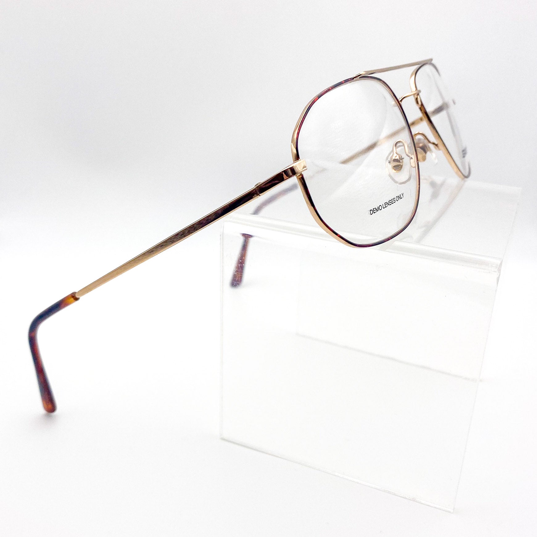 Vintage gold-framed aviators on a white background