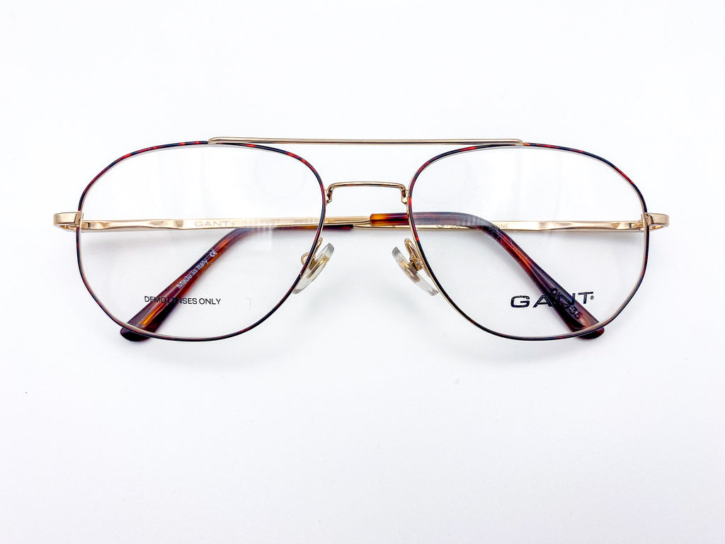 1980s Gant gold-framed aviator eyeglasses with tortoiseshell lenses on a white background