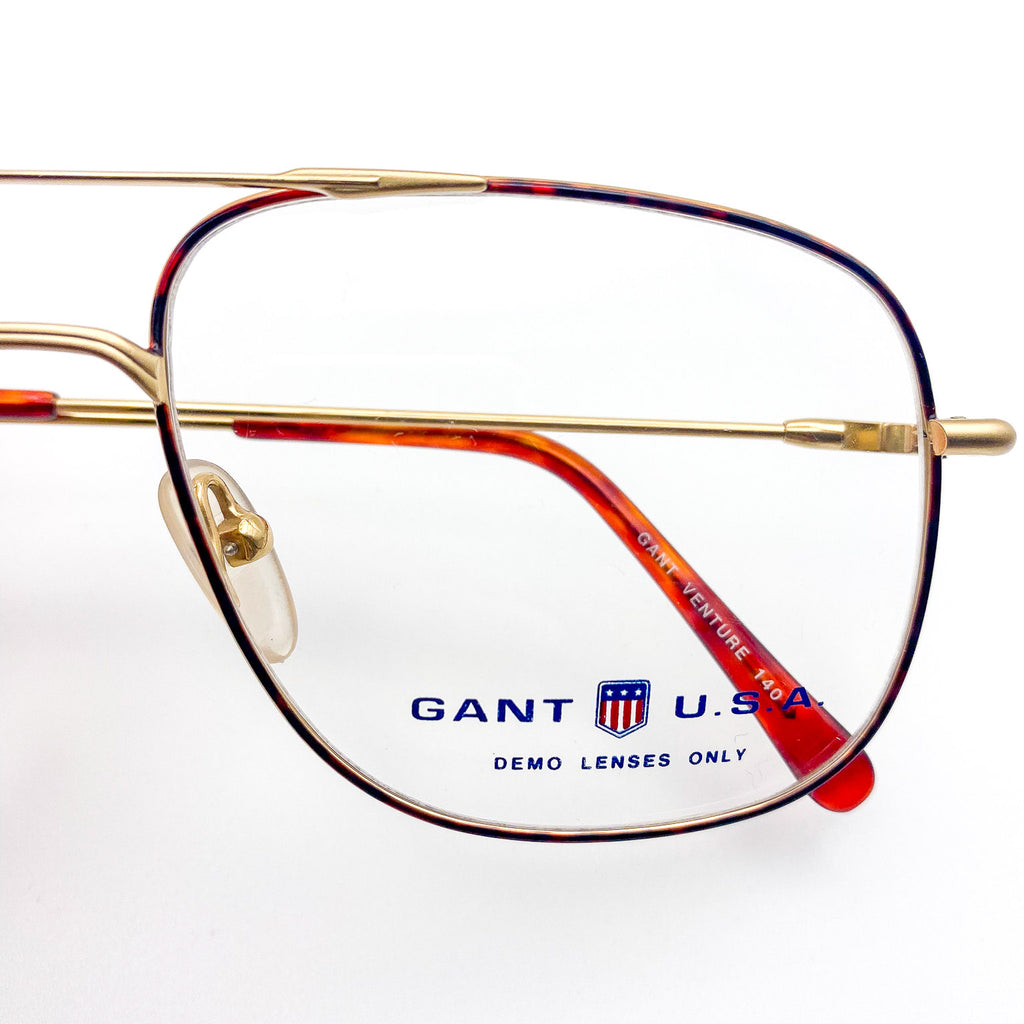 Gant U.S.A eyeglasses with tortoise and gold frame on a white background