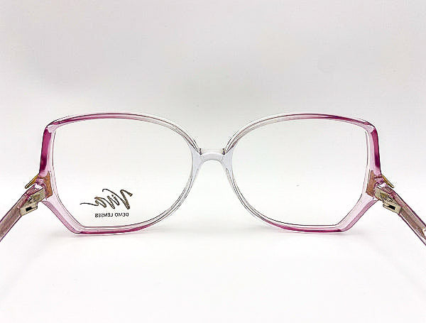 1980s purple and clear eyeglasses on a white background