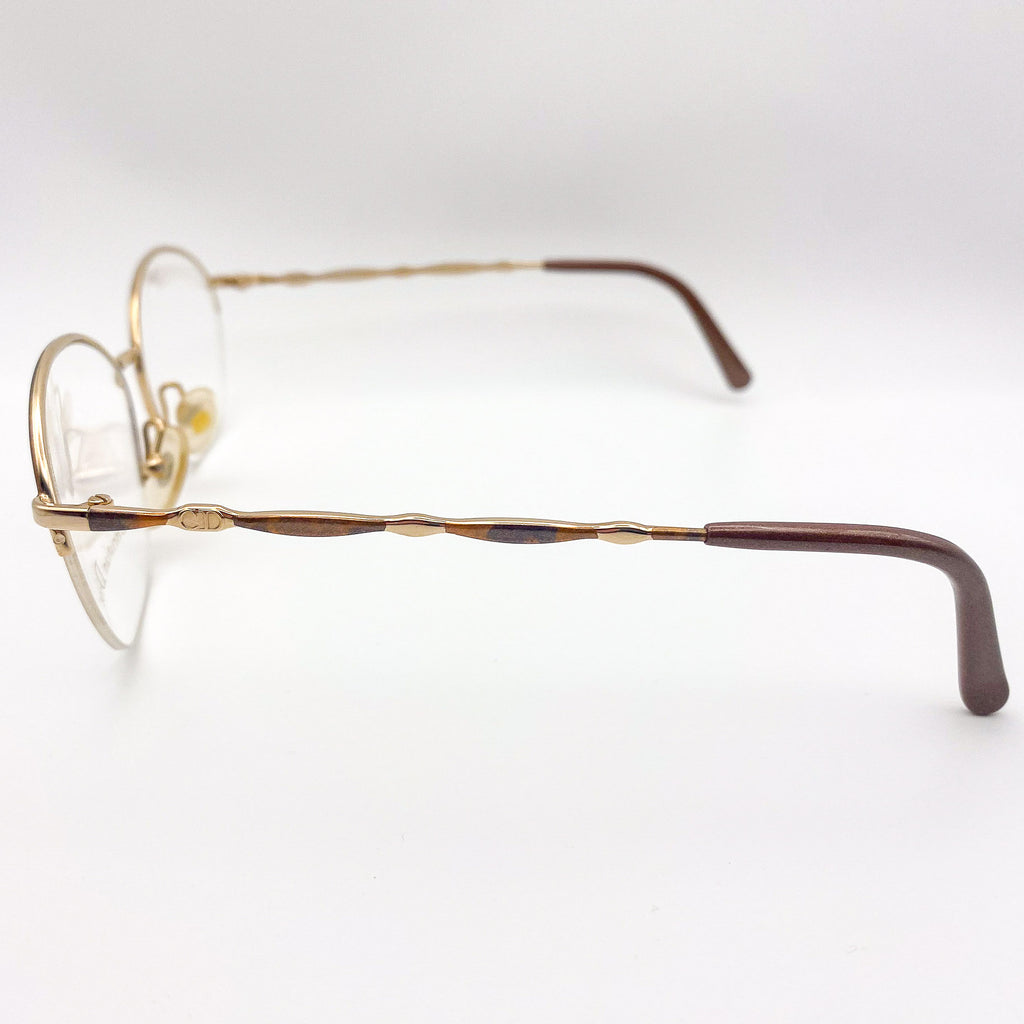 Gold-framed eyeglasses on a white background