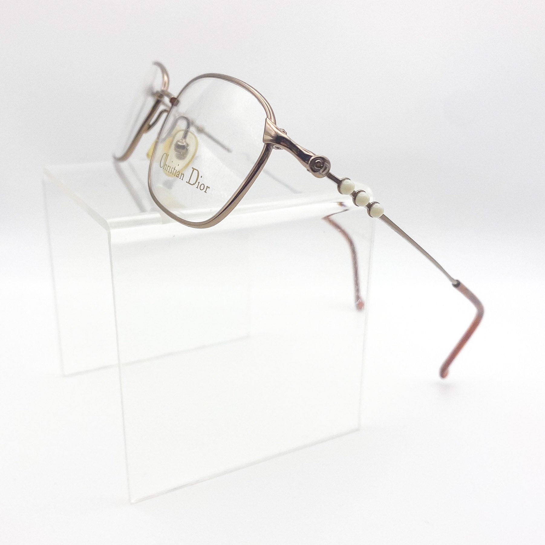 Vintage Dior eyeglasses on a white background