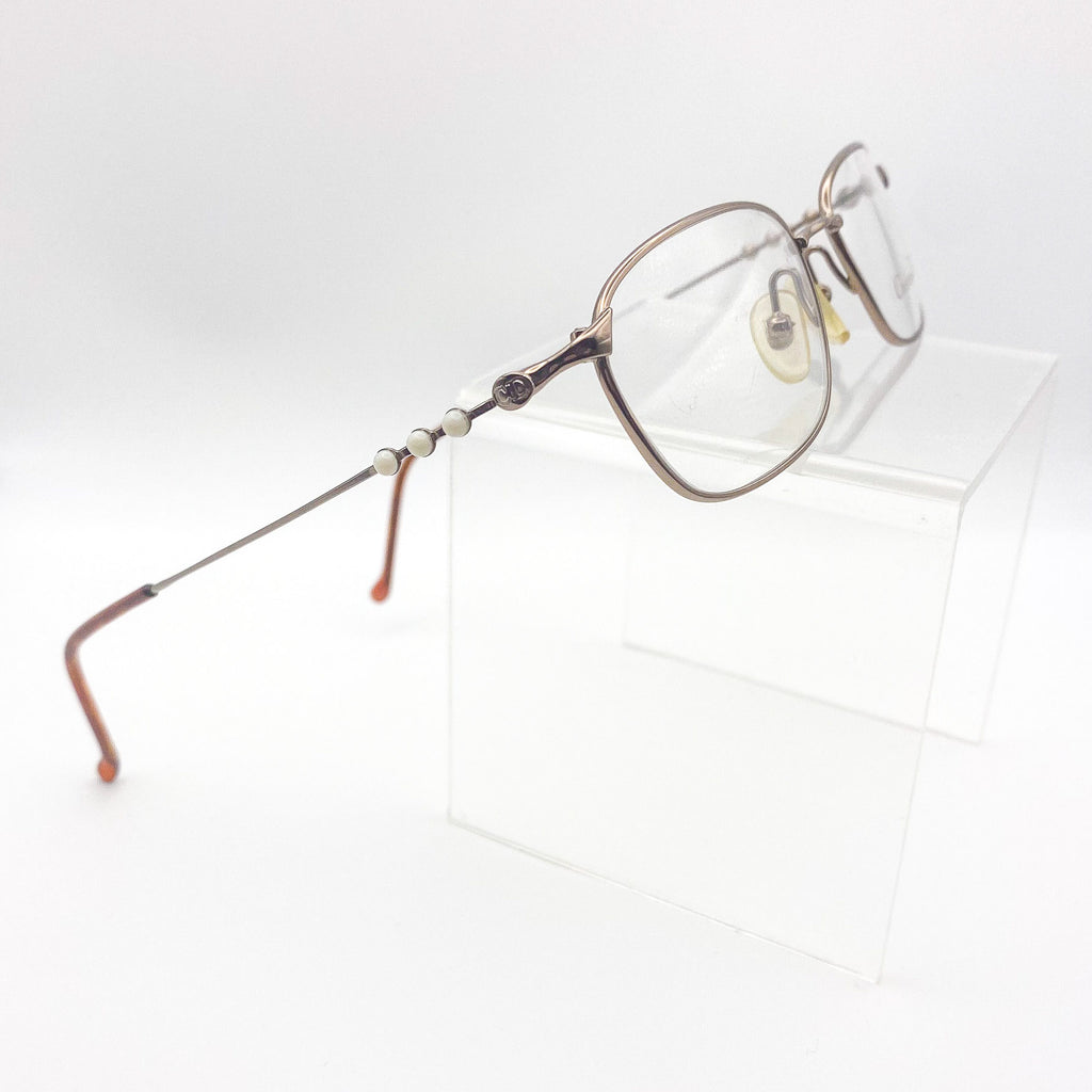 Eyeglasses with a decorative frame on a white background