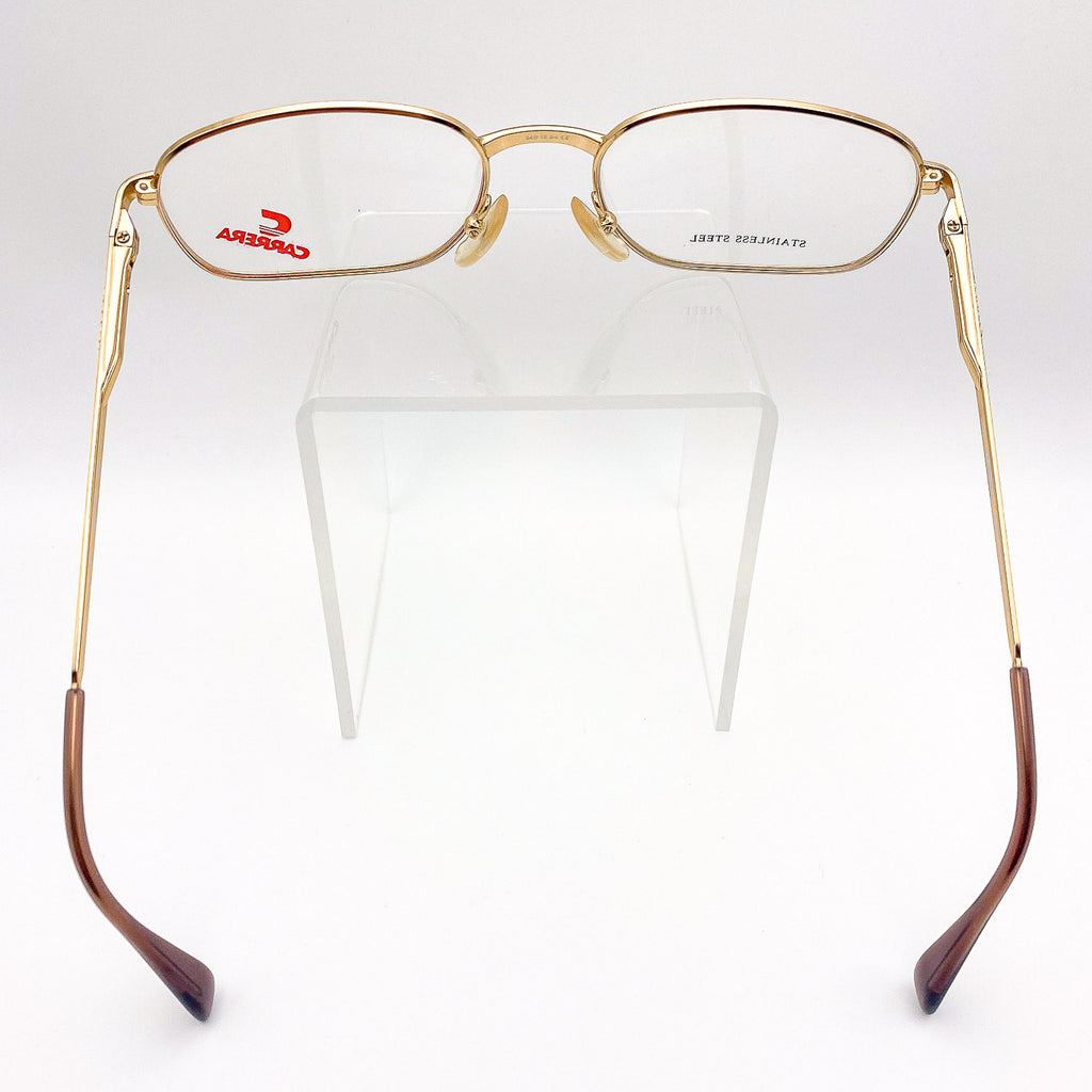 Gold-framed eyeglasses with brown accents on a white background