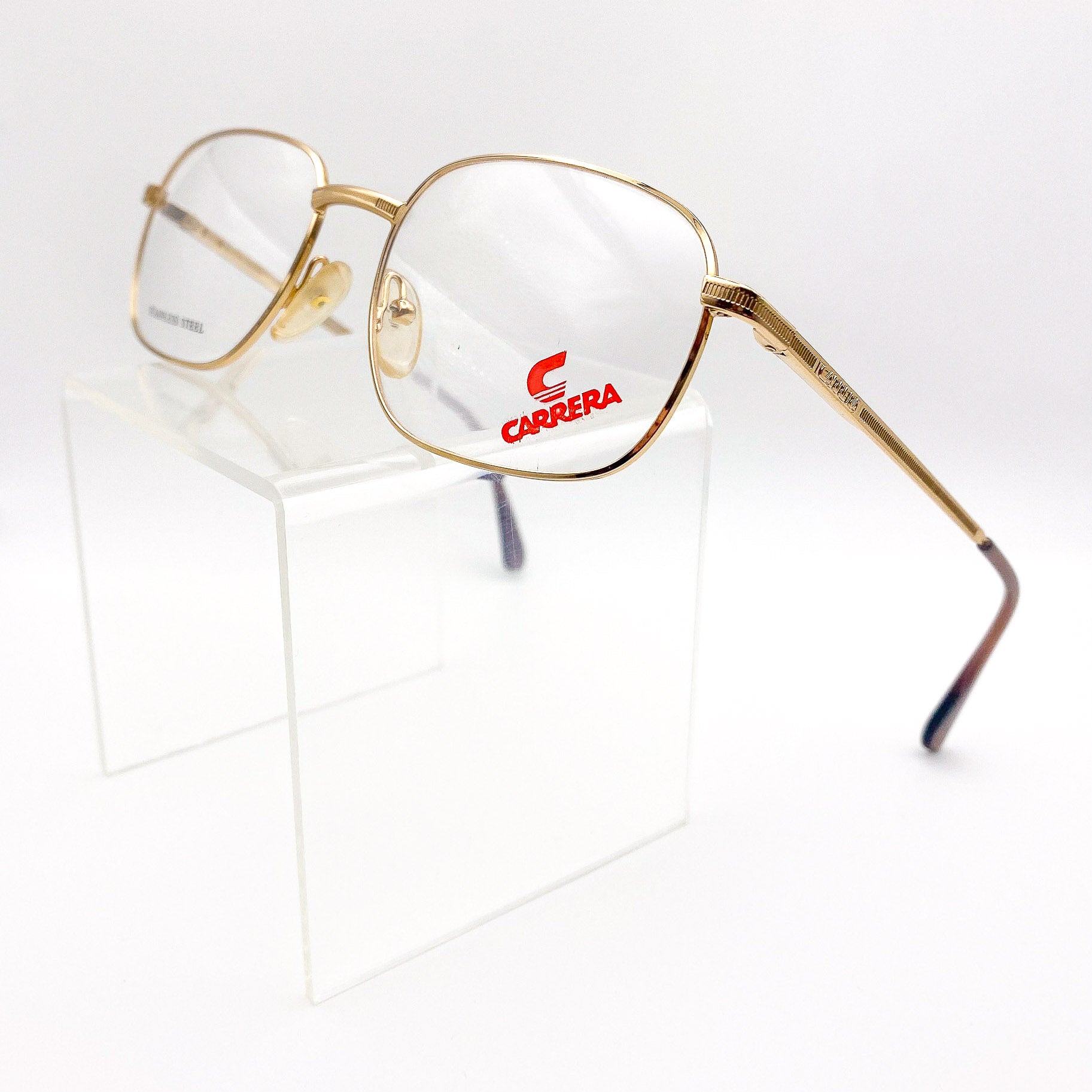 Gold-framed Carrera eyeglasses on a white background