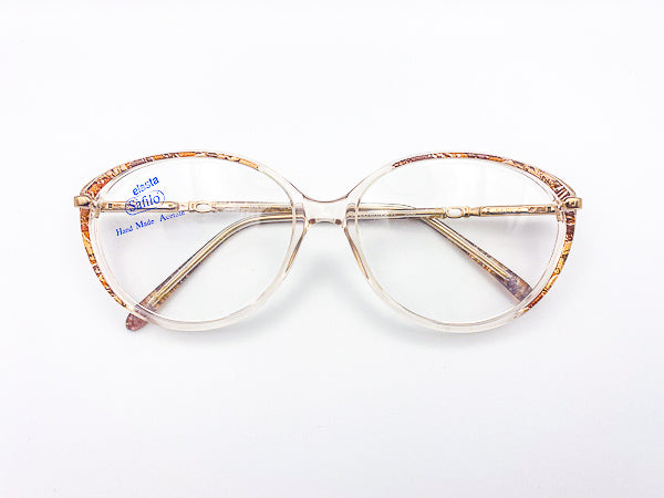 Vintage Safilo cat eye glasses with a decorative frame on a white background