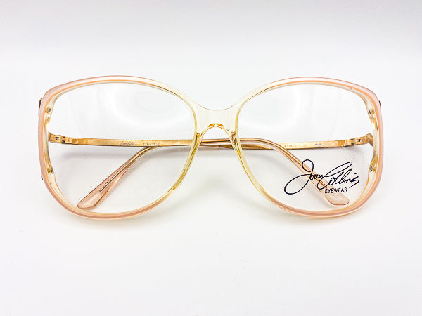 Oversized vintage eyeglasses with 'Joan Collins Eyewear' branding on a white background