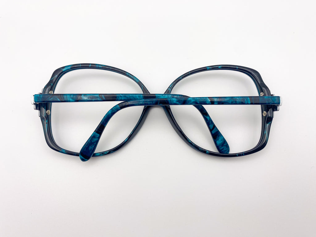 Vintage BerDel eyeglasses on a white background