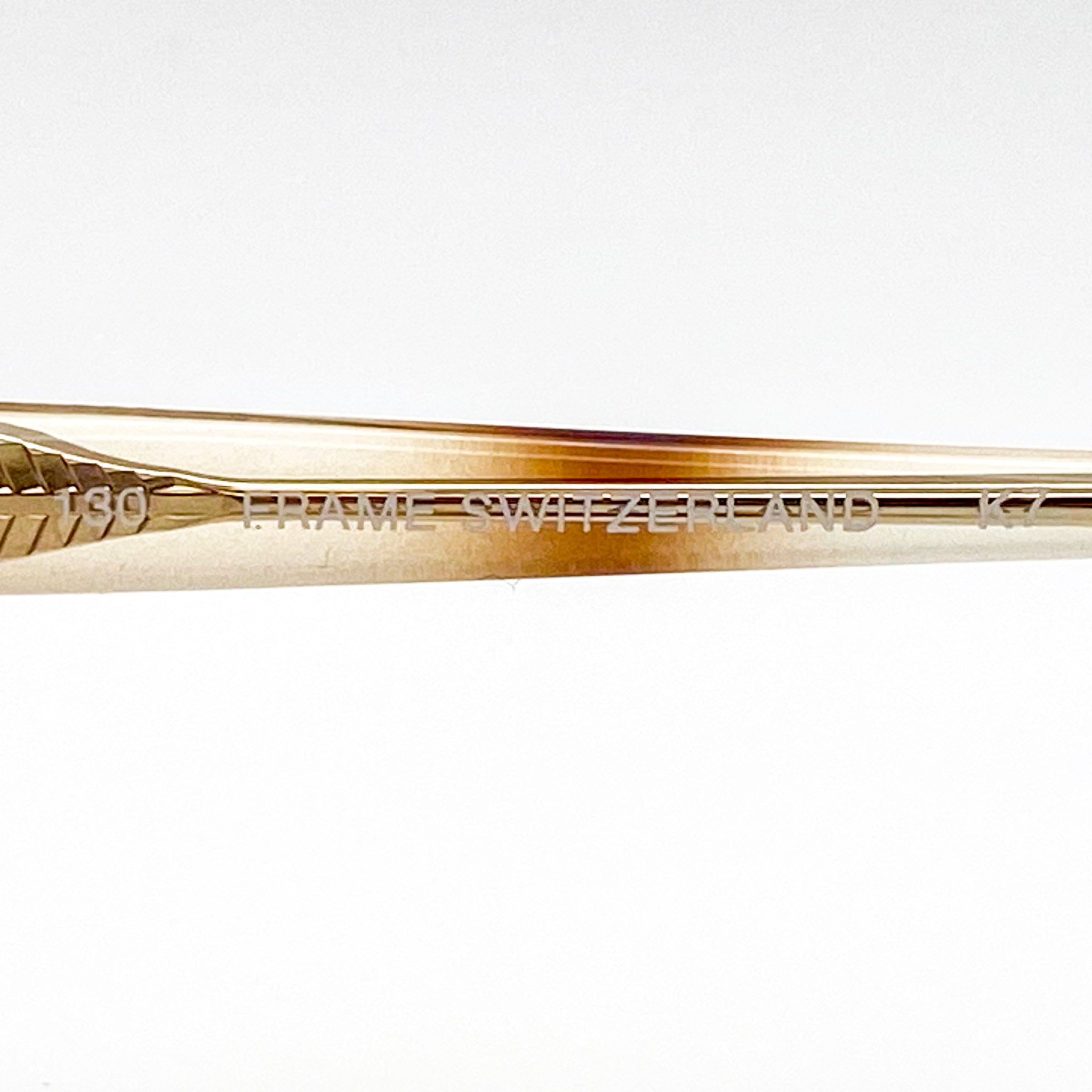 Eyeglasses temple stem with branding on a white background