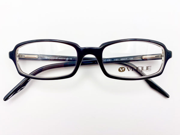 Black eyeglasses with 'Vogue' branding on a white background