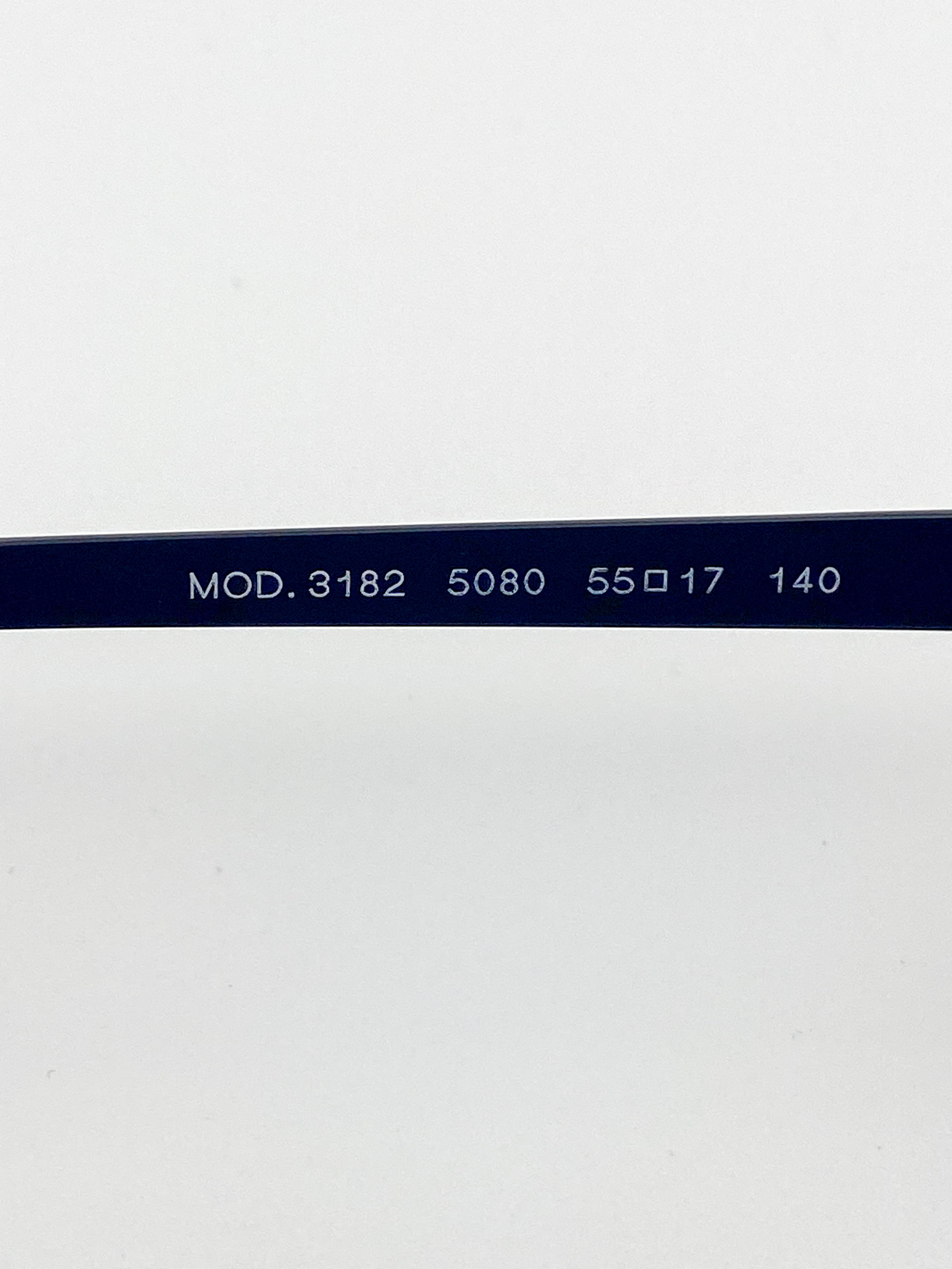 Close-up of a black eyeglass frame with model and size details on a white background