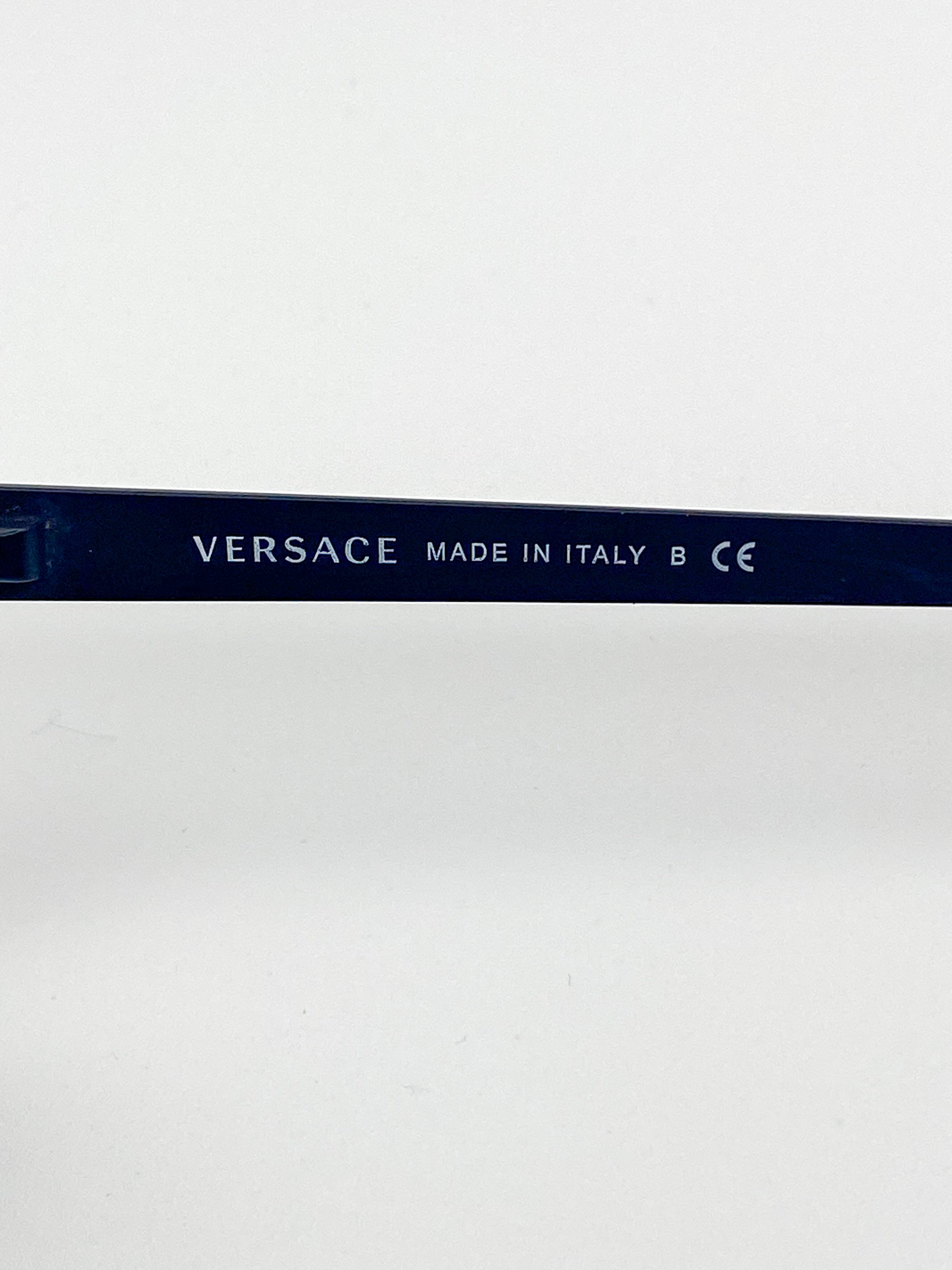 Versace eyeglasses with 'Made in Italy' text on a white background