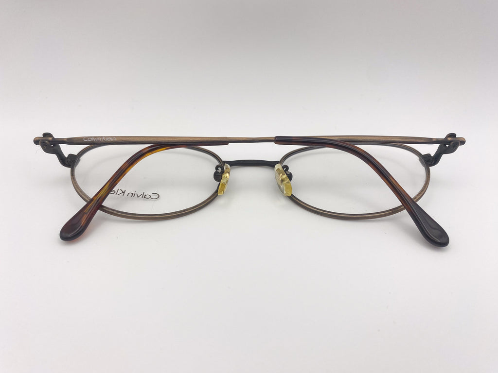 Pair of eyeglasses with a tortoiseshell frame on a white background