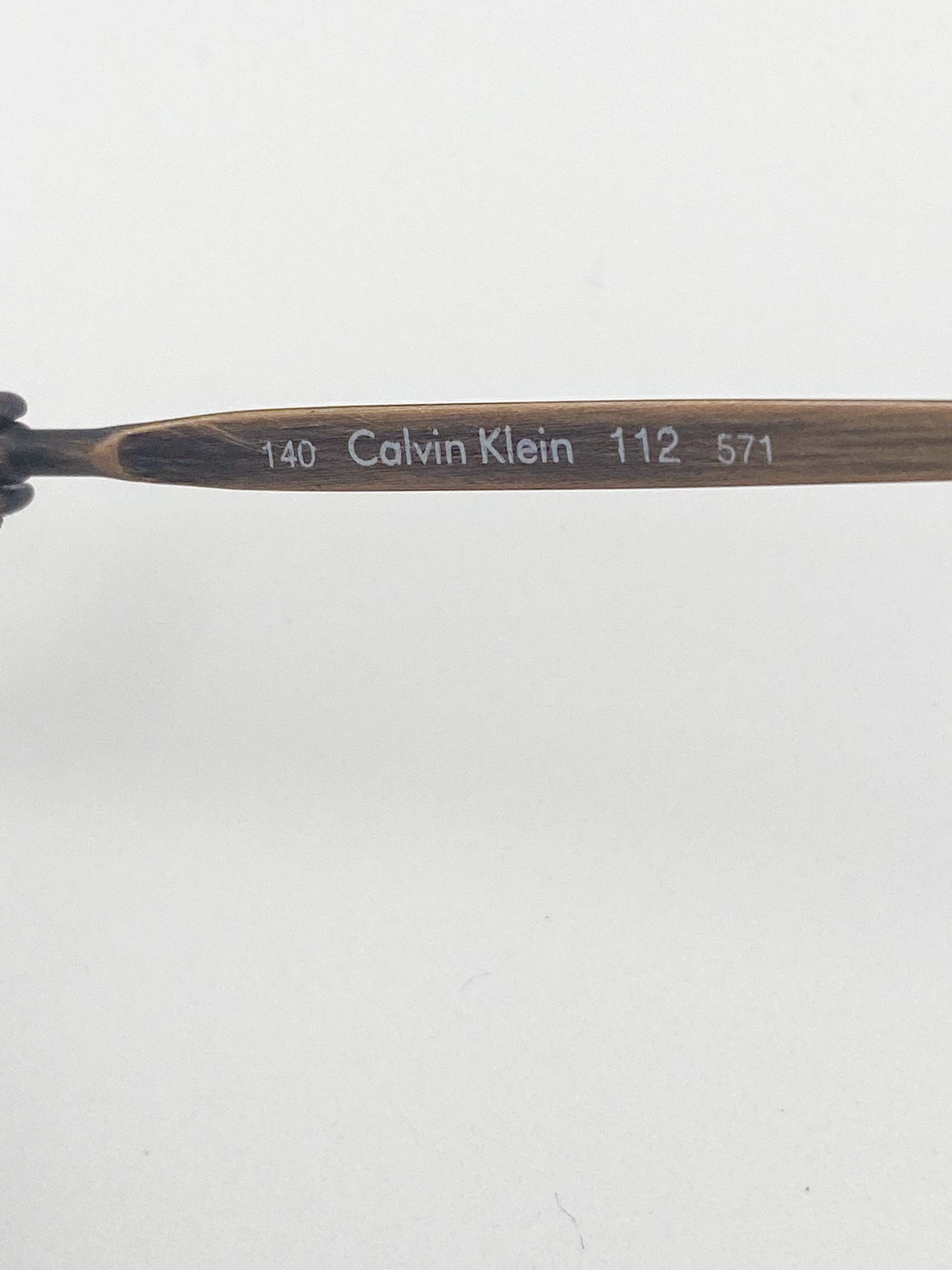 Calvin Klein eyeglass temple stem on a white background