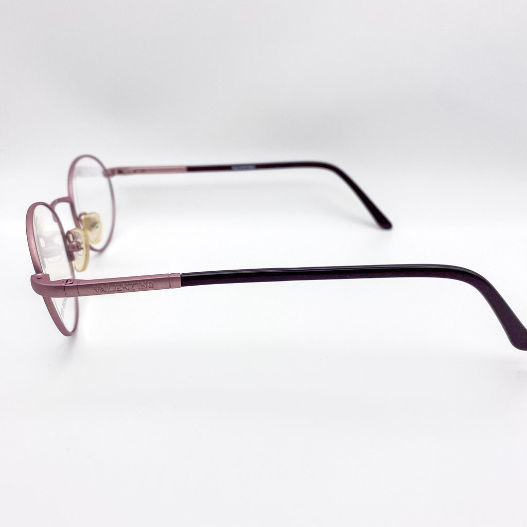 Eyeglasses with a lavender frame on a white background