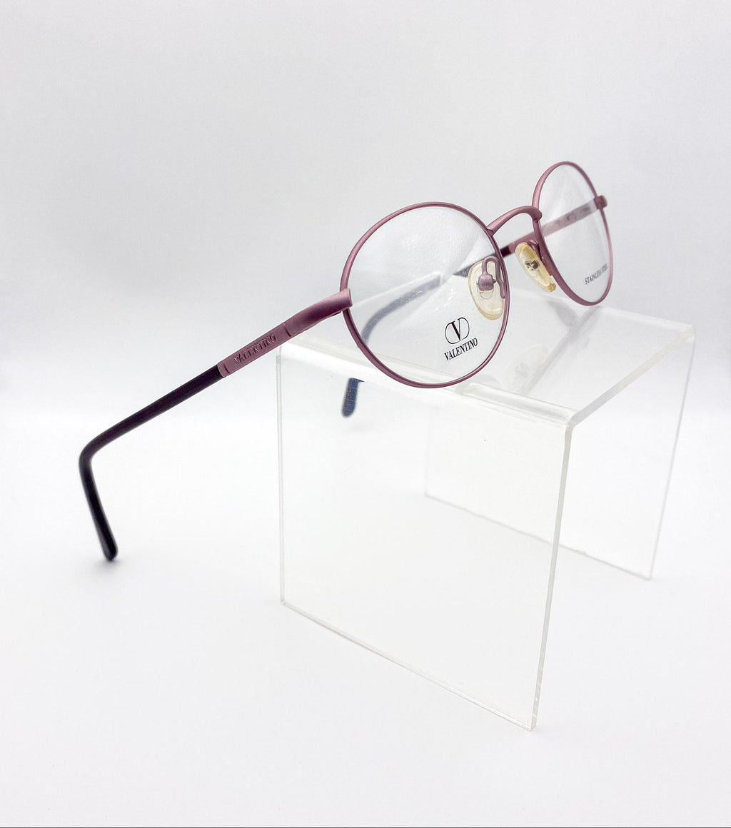 1990s Valentino eyeglasses on a white surface