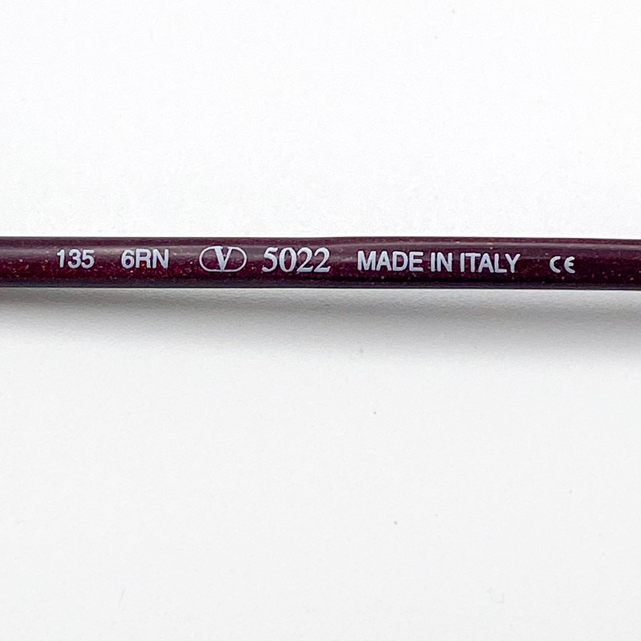 Eyeglasses with branding and product details on a white background