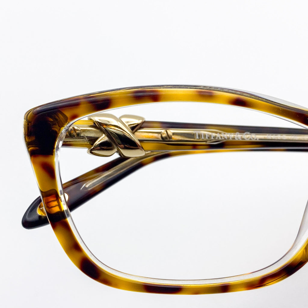 Tiffany & Co. rectangular eyeglasses with gold accents on a white background