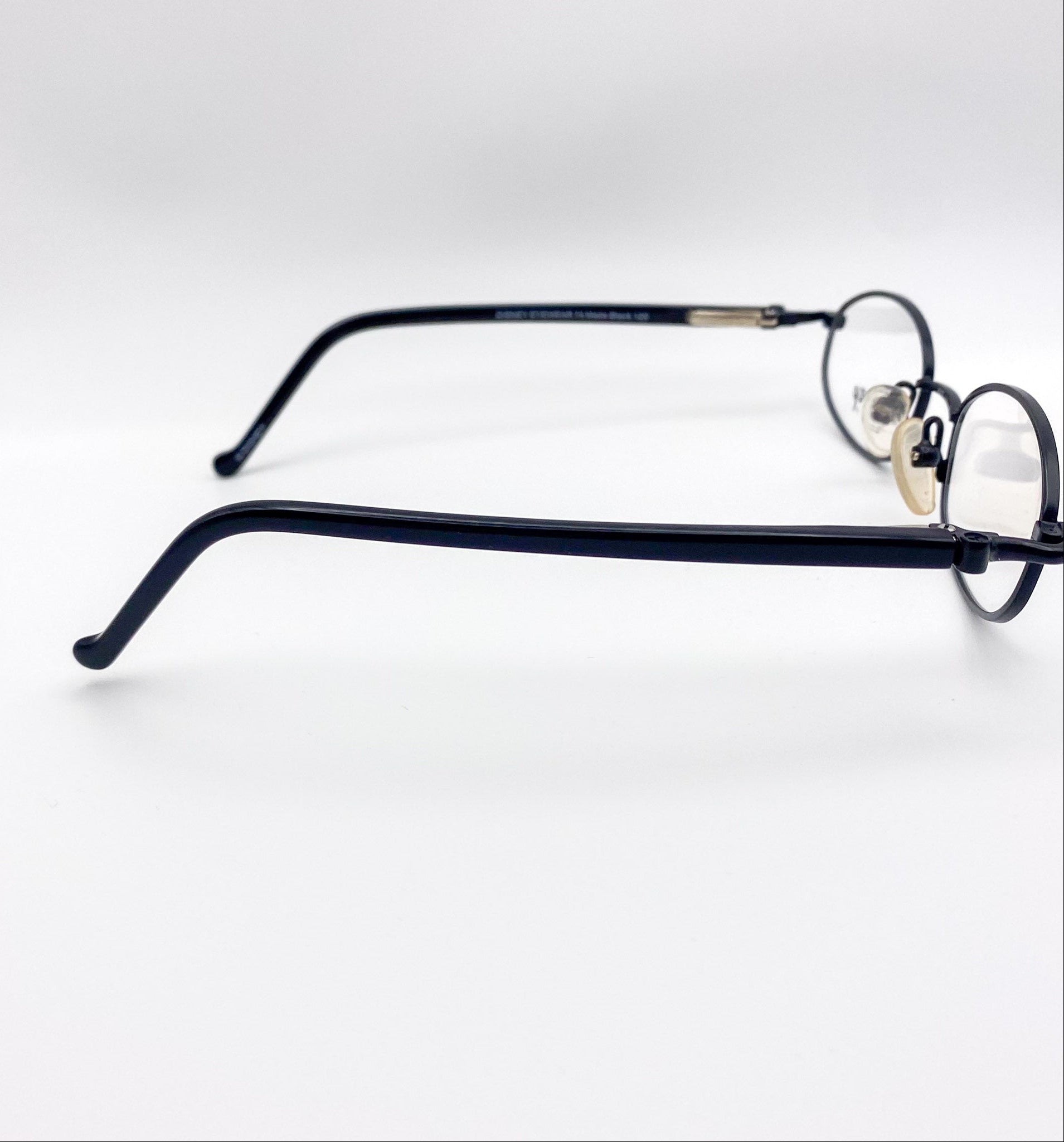 Pair of kids metal eyeglasses on a white background