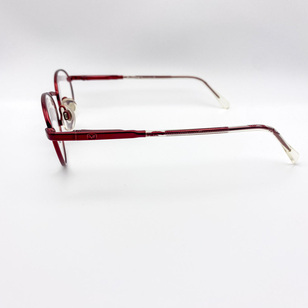 Red eyeglasses on a white background