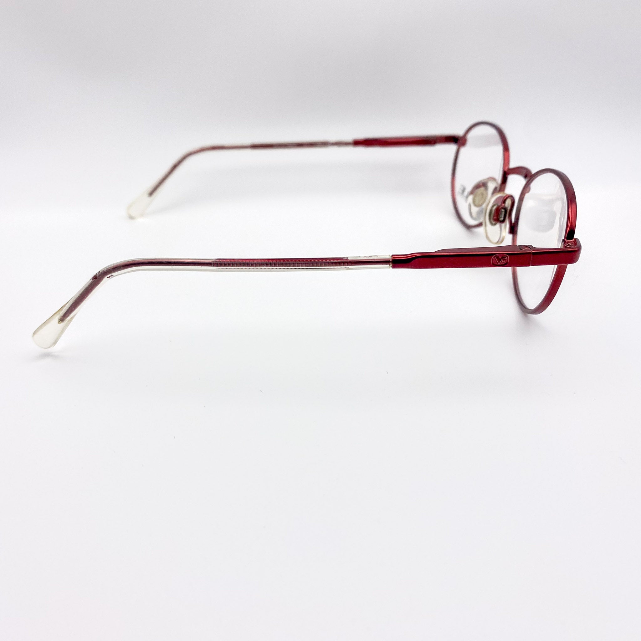 Red eyeglasses on a white background