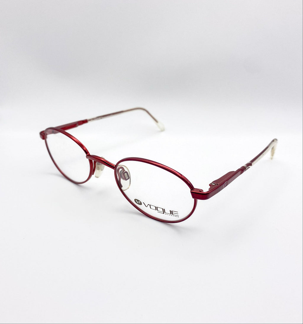 Red kids eyeglasses with 'Vogue' logo on a white background