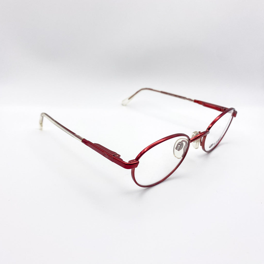 Red metal eyeglasses on a white background