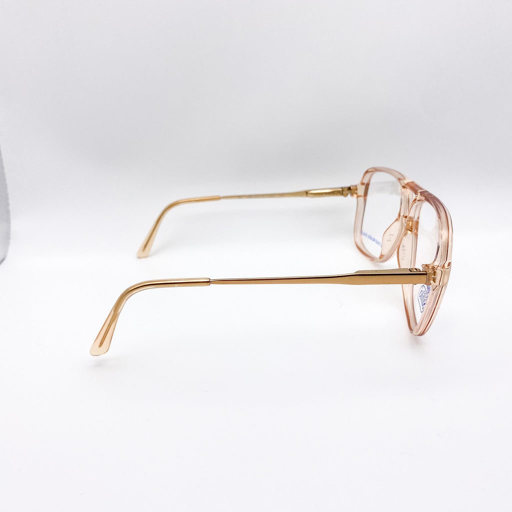 Gold-framed eyeglasses on a white background