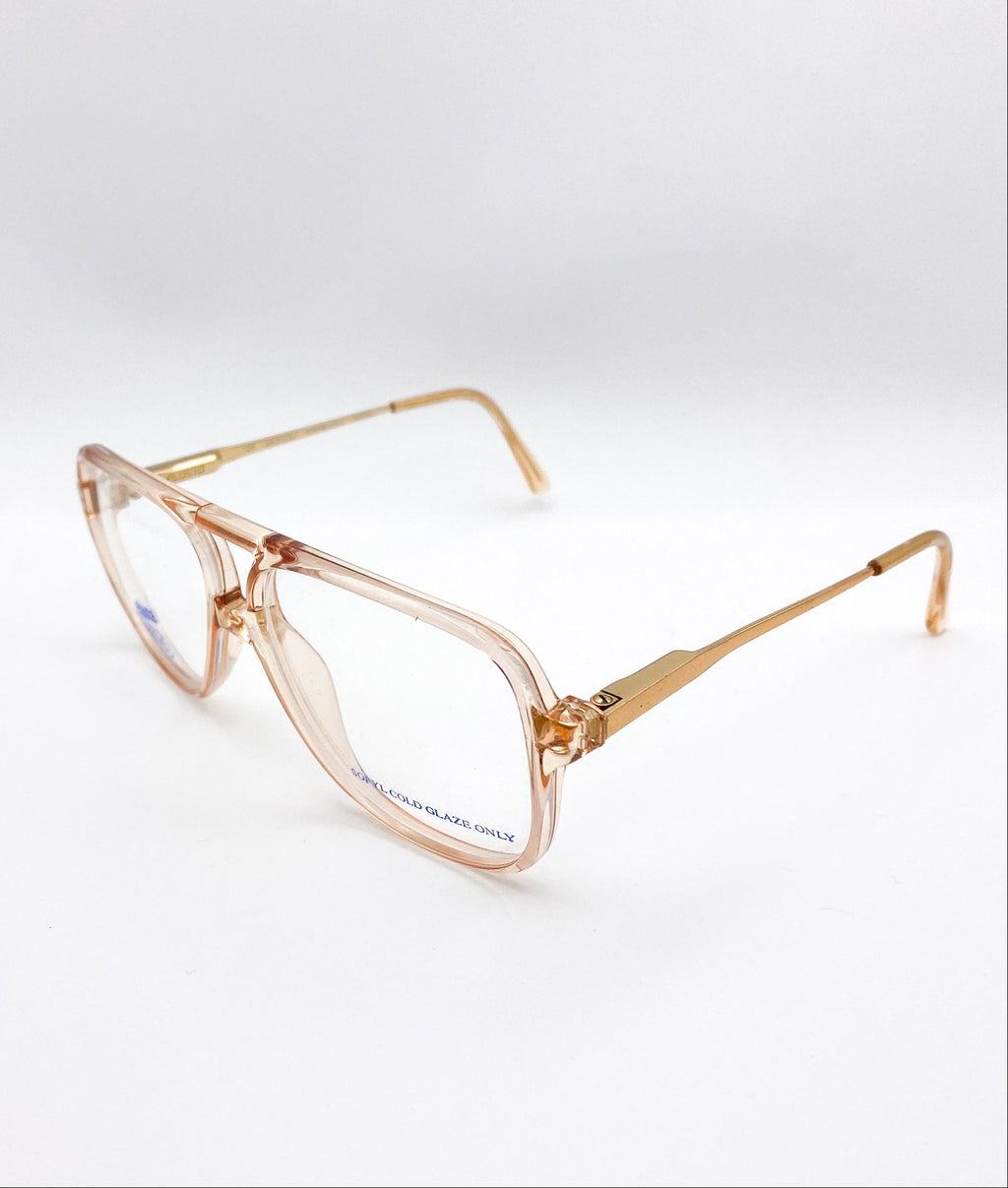 Gold-framed eyeglasses on a white background
