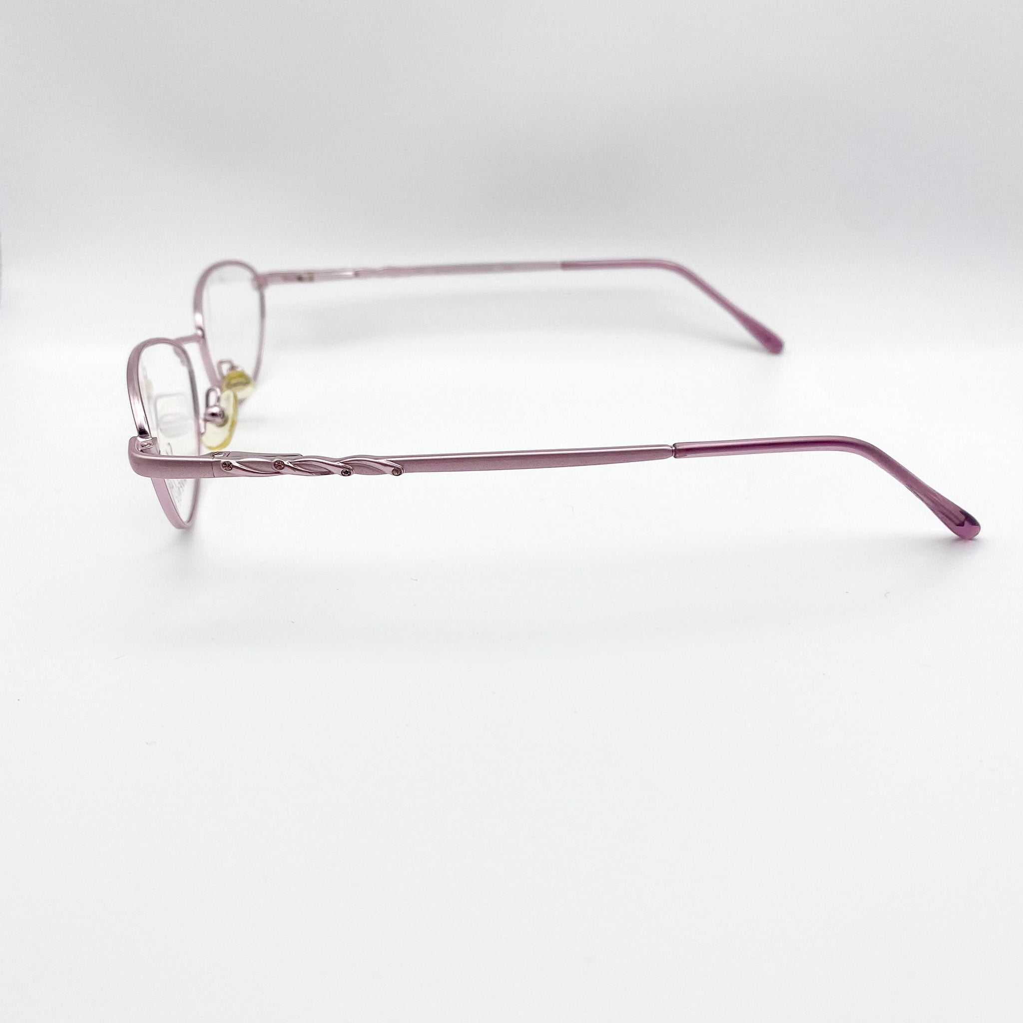 Metallic lavender eyeglasses on a white background