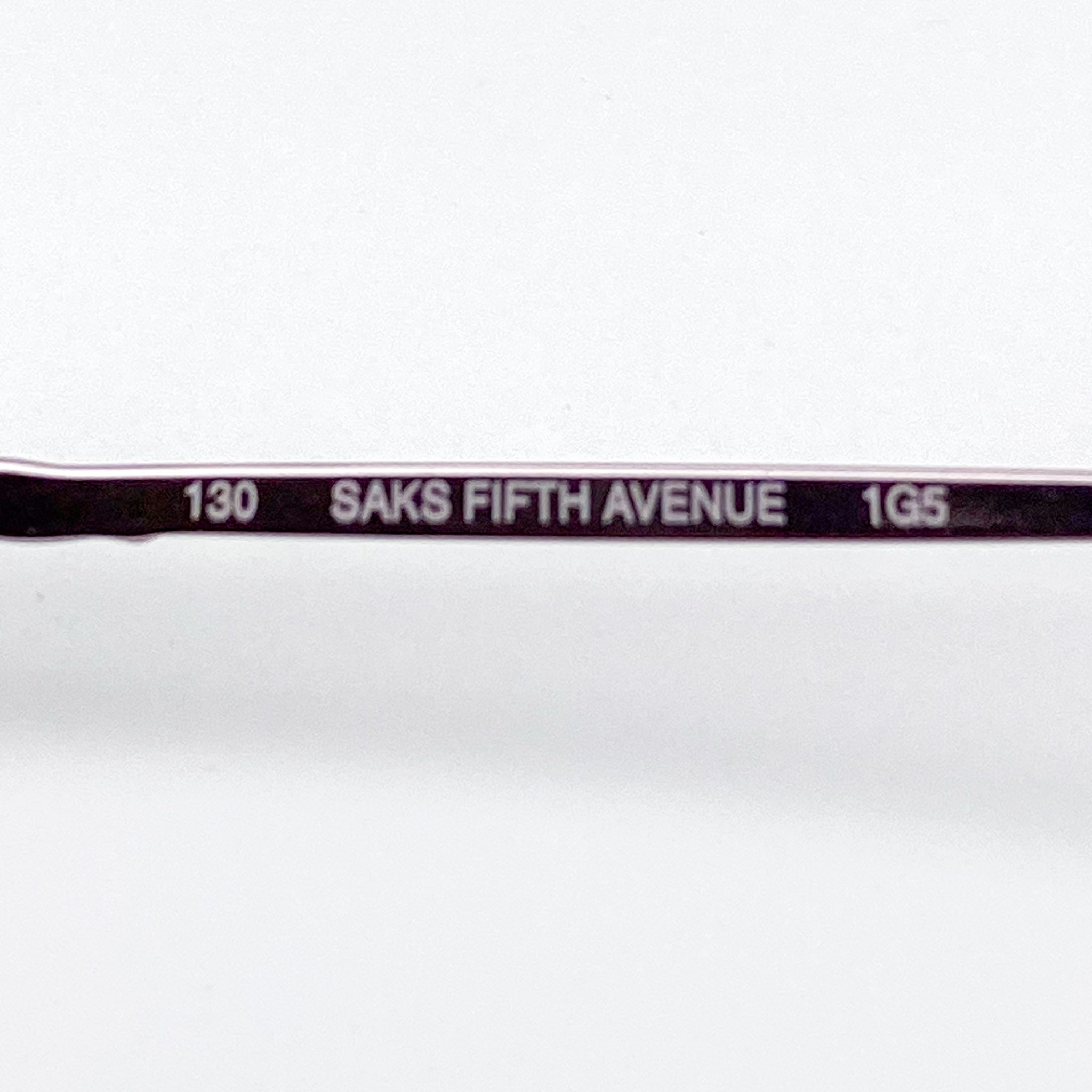 Eyeglasses frame with 'Saks Fifth Avenue' text on a white background