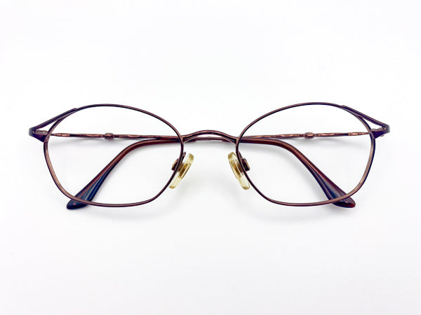 Vintage Yves Saint Laurent eyeglasses on a white background