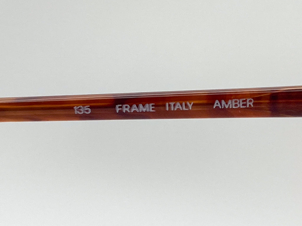 Brown frame with '135', 'FRAME', 'ITALY', and 'AMBER' text on a white background