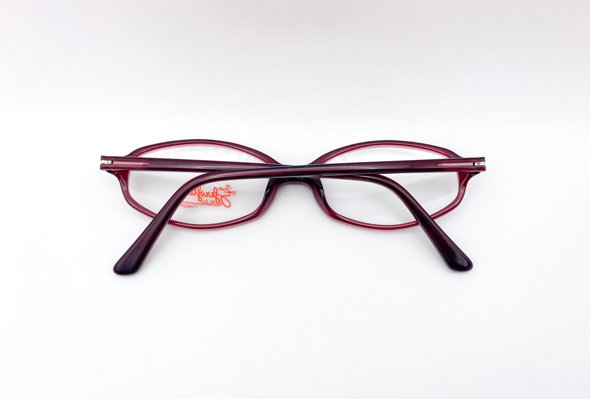Pair of eyeglasses with a visible brand logo on a white background