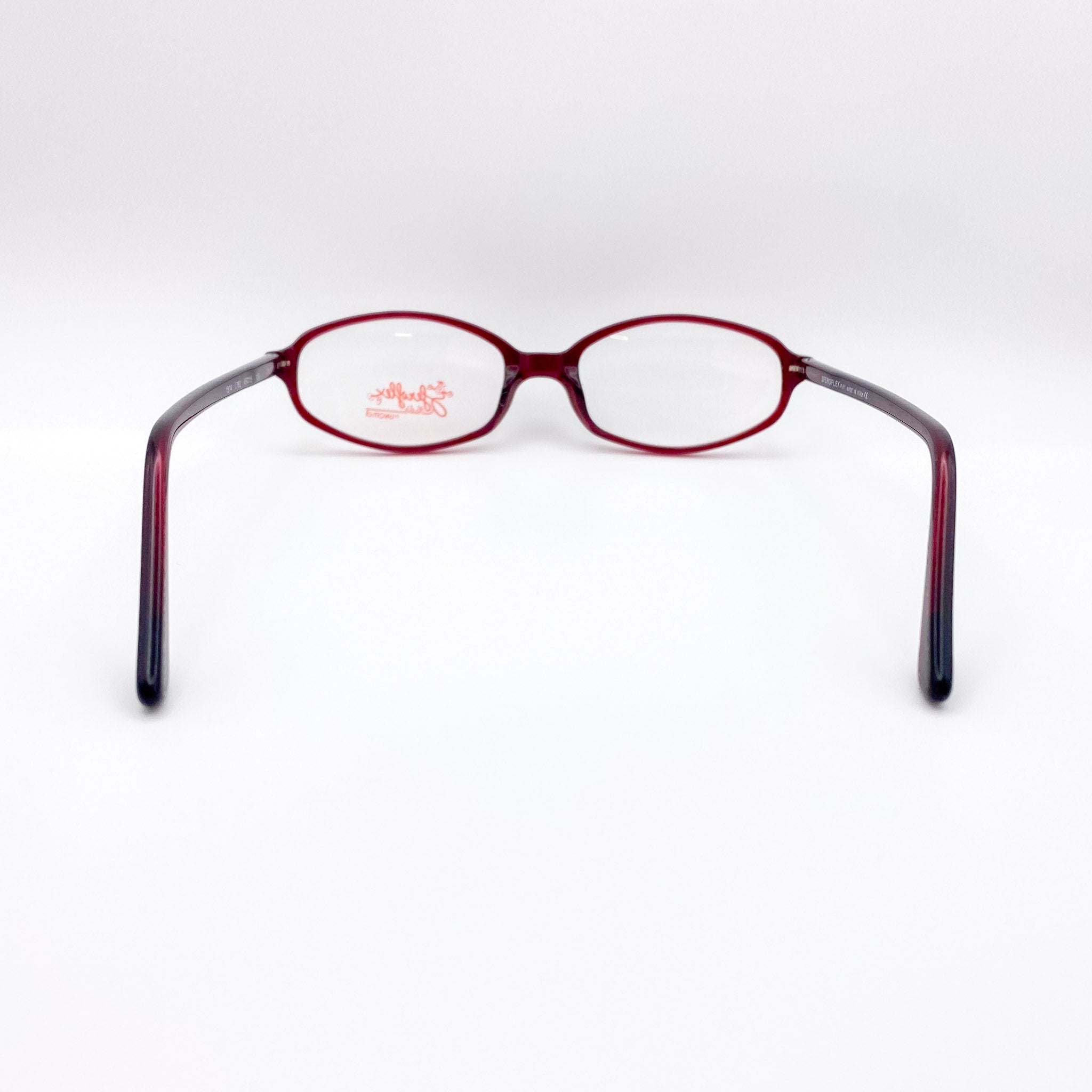 Red eyeglasses on a white background