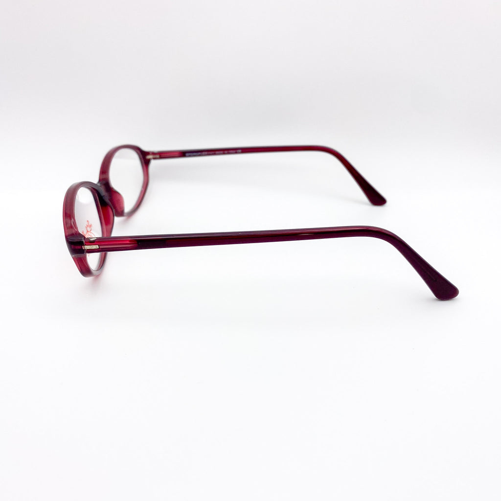 Red eyeglasses on a white background
