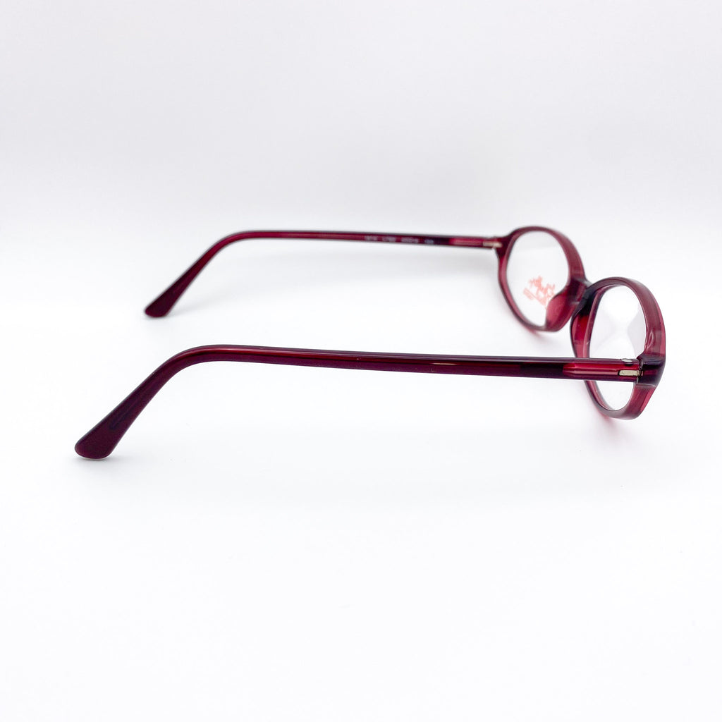 Red eyeglasses on a white background