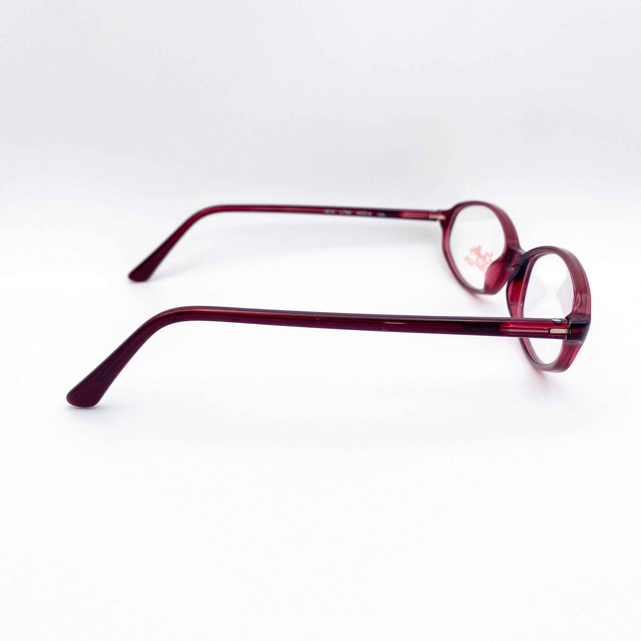 Red eyeglasses on a white background