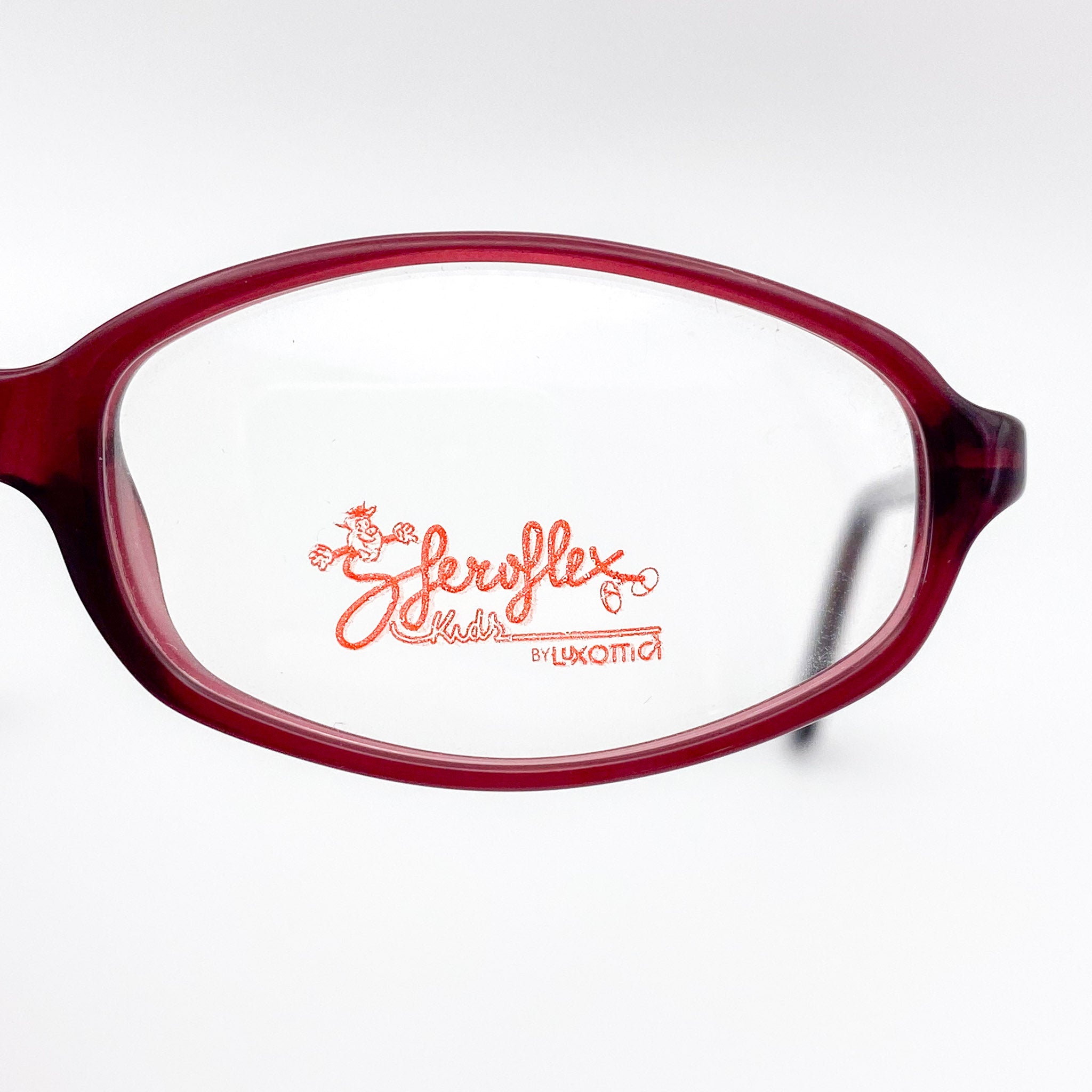 Red eyeglasses with a visible brand logo on a white background