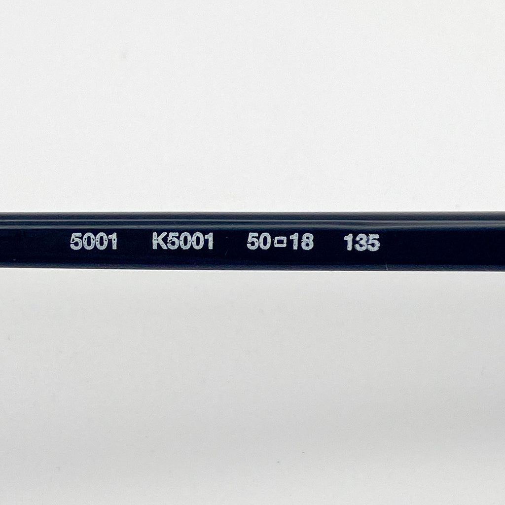 Close-up of an eyeglasses temple with engraved text on a white background