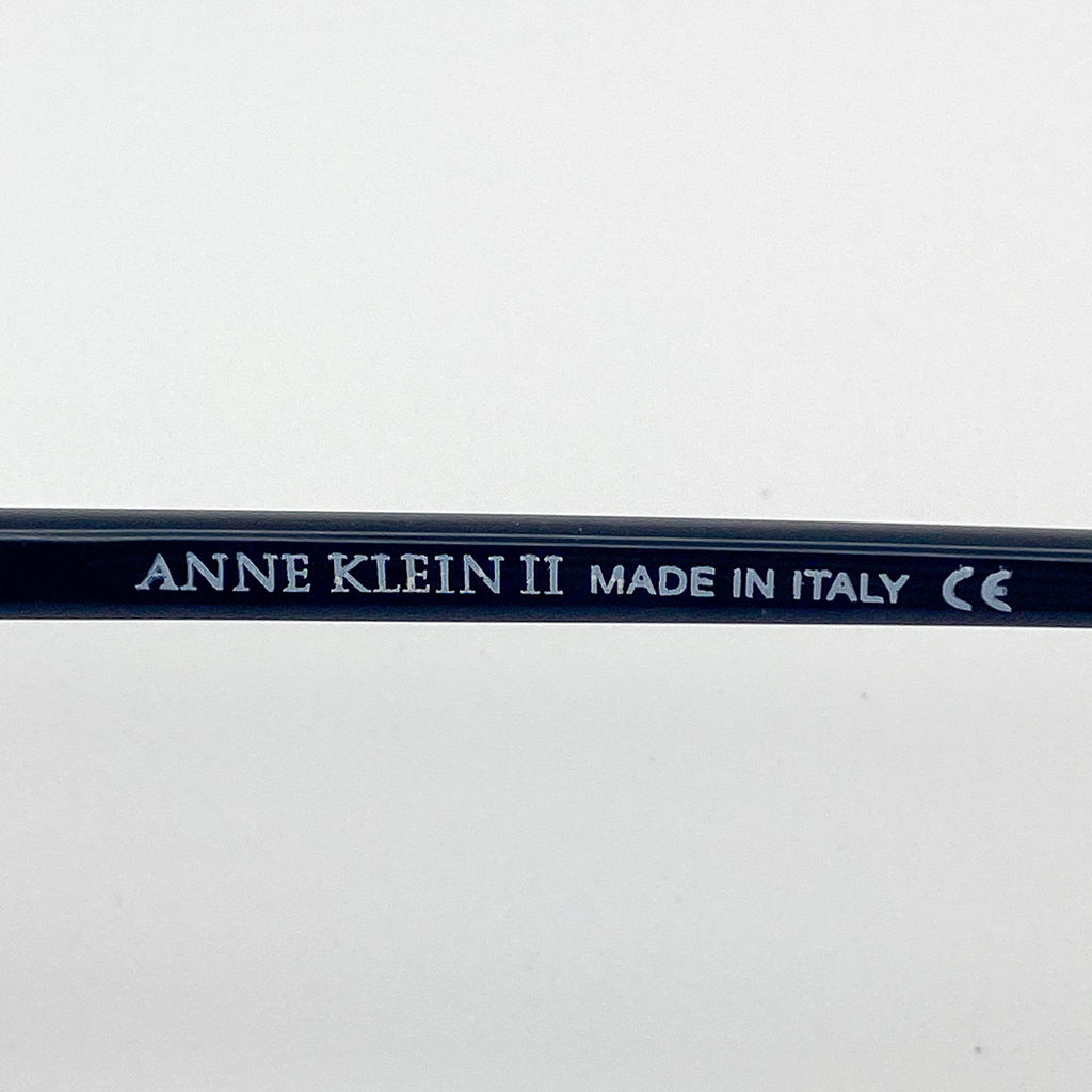 Black temple arm with 'Anne Klein II' branding on a white background