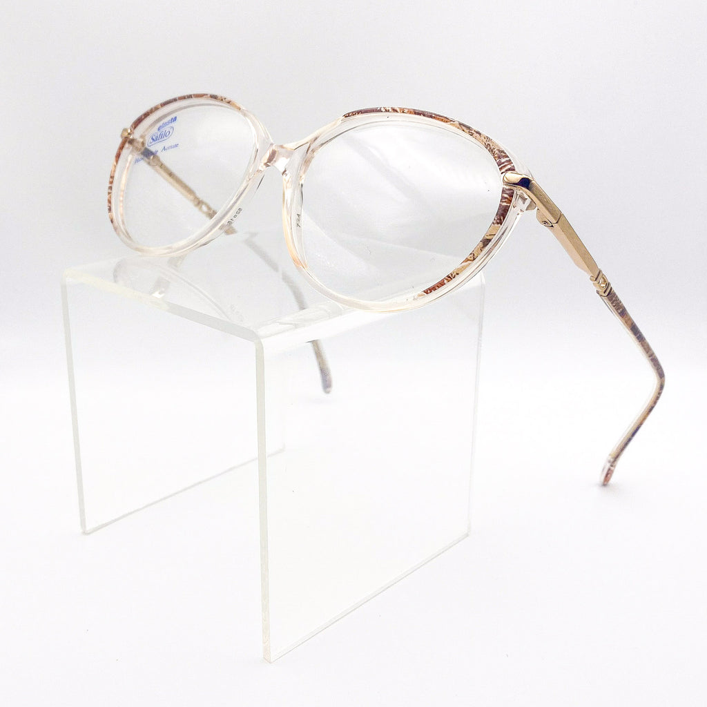 Gold-framed eyeglasses on a white background