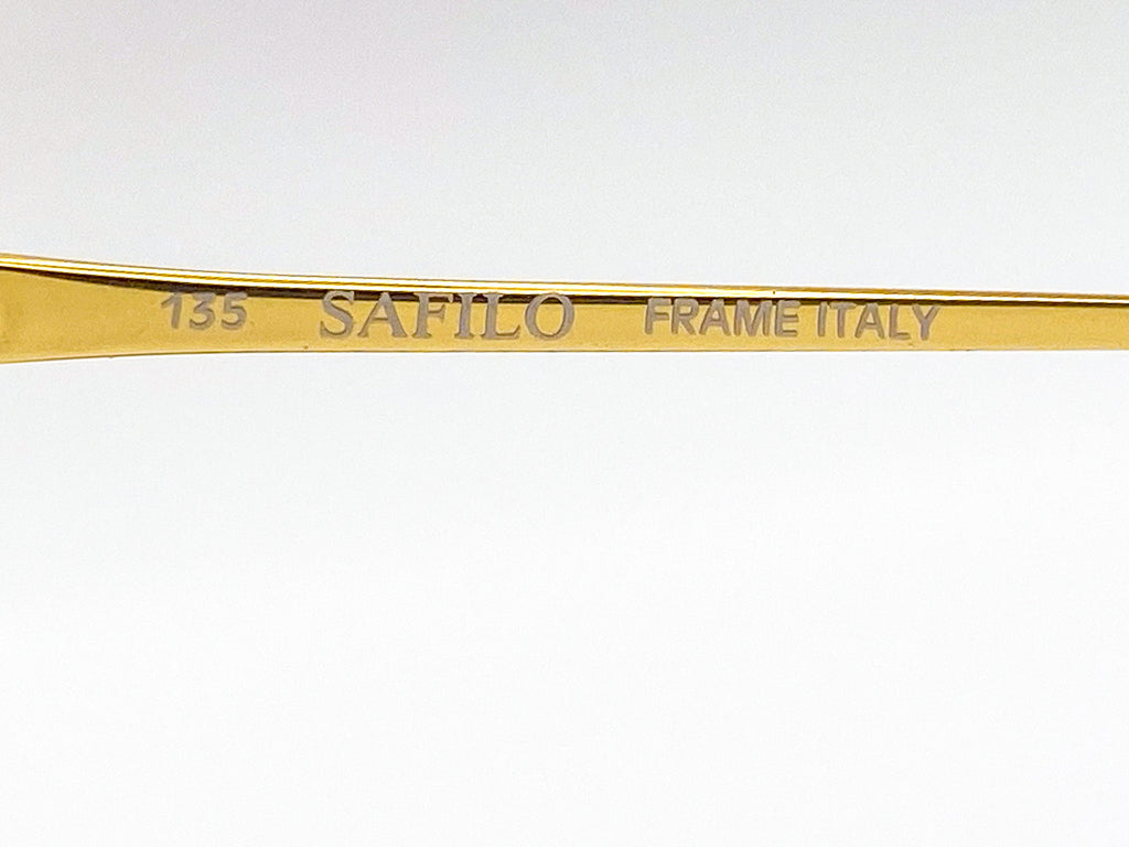 Gold frame with 'Safilo' branding on a white background