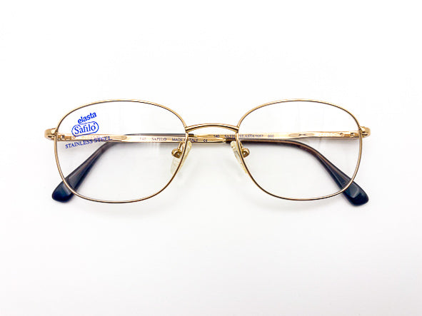 Gold-framed eyeglasses with 'Safilo Elasta' label on a white background