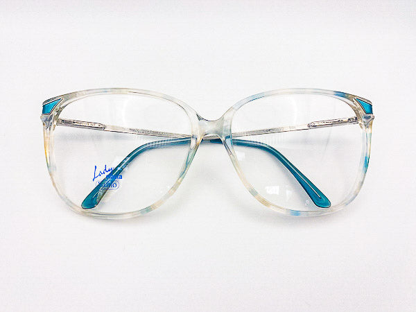 Clear vintage oversized eyeglasses with blue accents on a white background