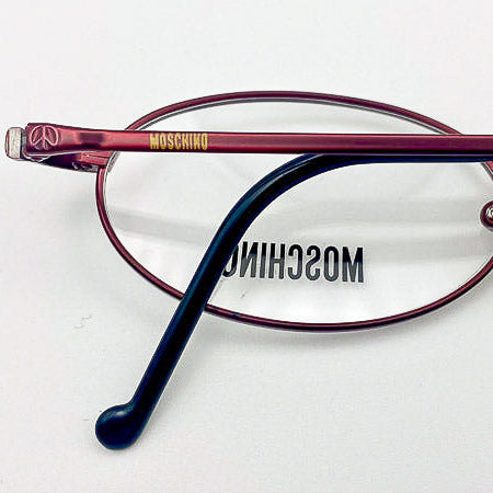 Moschino eyeglasses on a white background