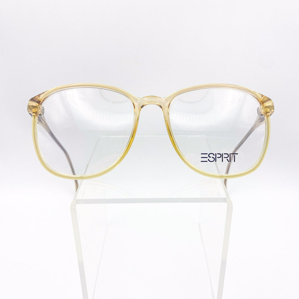 Clear yellow glasses with 'Esprit' logo on a white background