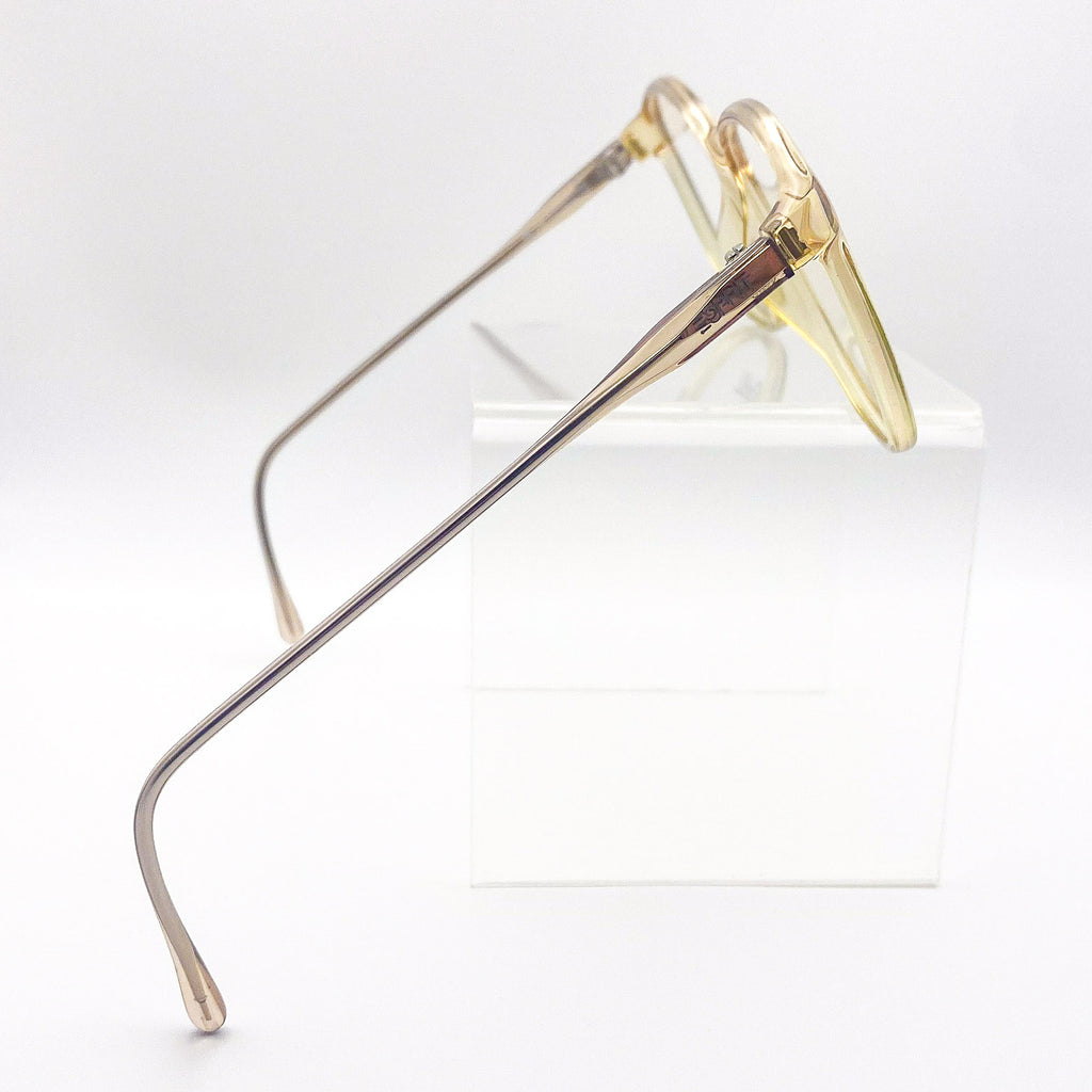 Yellow eyeglasses on a white background