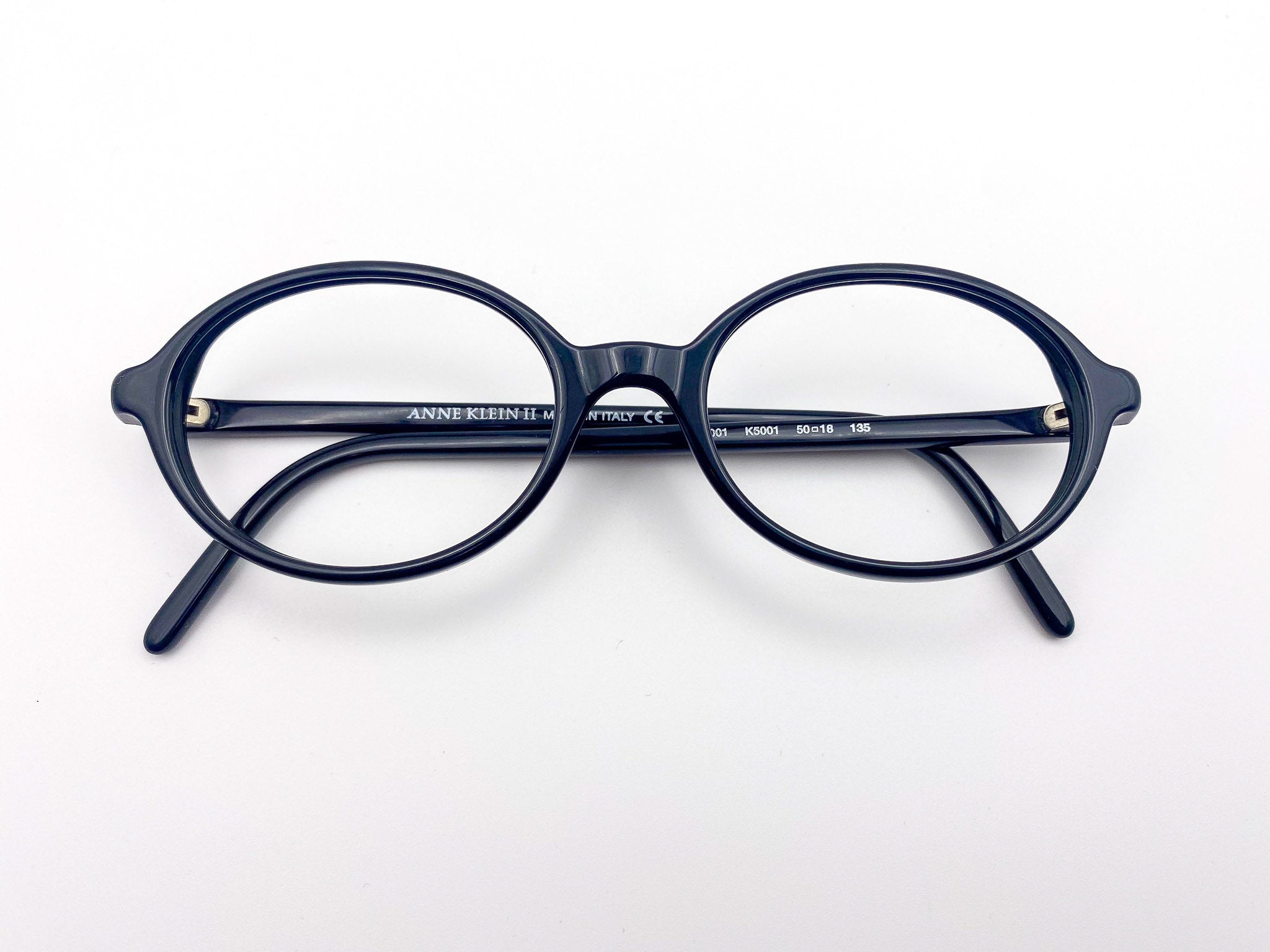 Round black eyeglasses on a white background