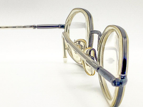 Close-up of a pair of octagonal eyeglasses with a white background
